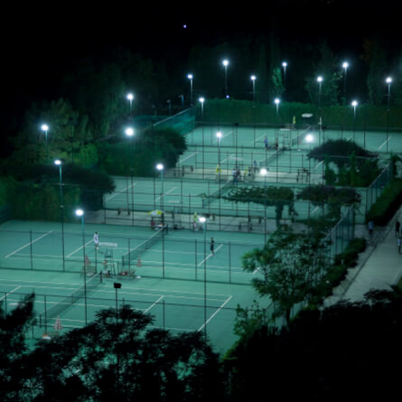 view over tennis courts at night